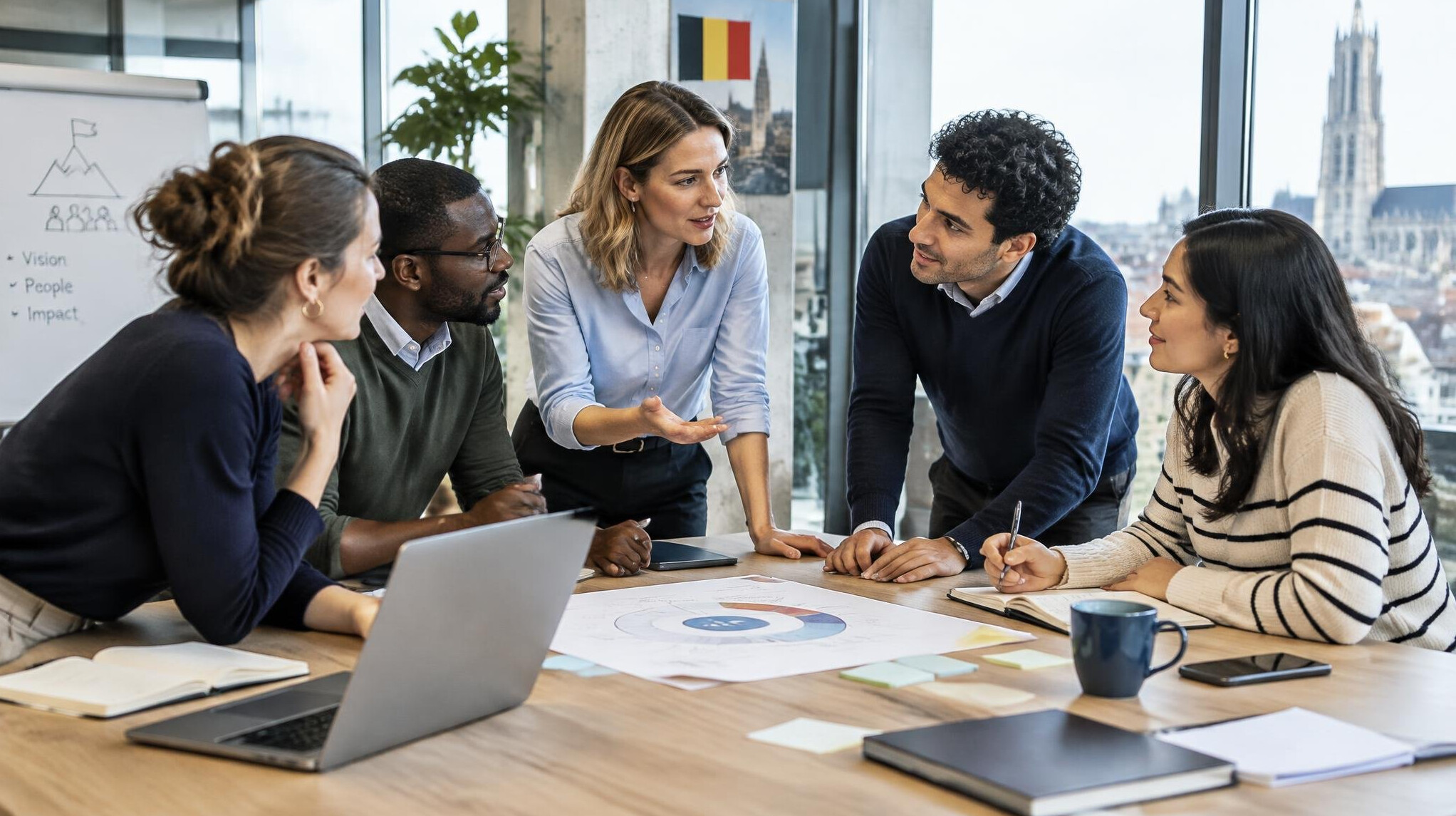 Team of colleagues discussing leadership strategy in a bright office